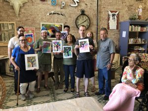 Diverse Group with Paintings